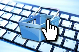 Carrinho compras teclado azul representando comércio transações online resultado financeiro